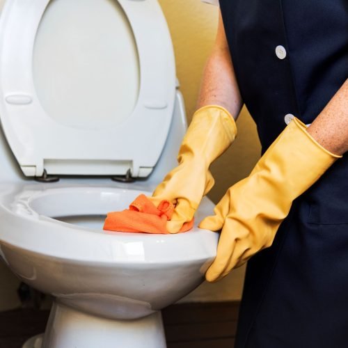 housekeeper-cleaning-hotel-room.jpg